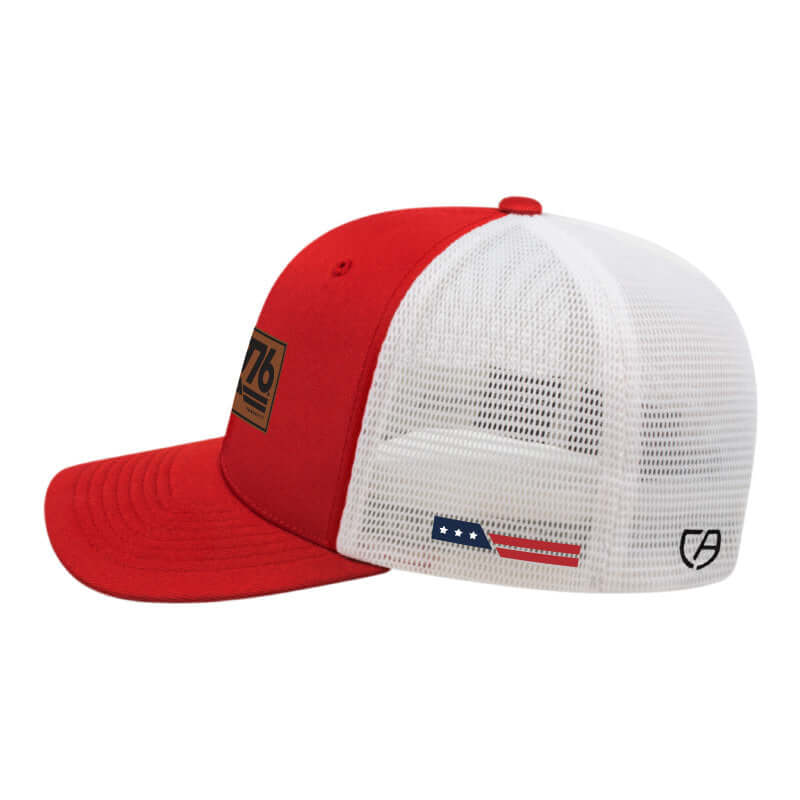 1776® Leather Patch Hat in red and white with mesh back and embroidered details, showcasing American heritage style.